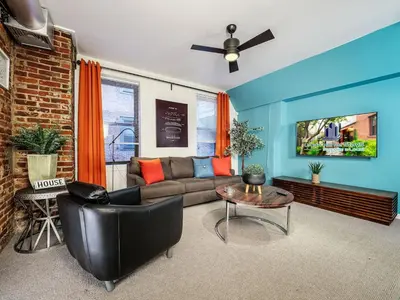 a living room with a couch and a table at Charming 1BR in Philly with Courtyard View in Philadelphia