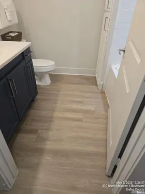 a bathroom with a toilet and a sink at Downtown Philly 1BR with Stunning Views in Philadelphia