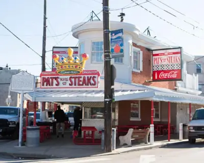 a fast food restaurant with a crown sign on a street at Downtown Philly 1BR with Stunning Views in Philadelphia