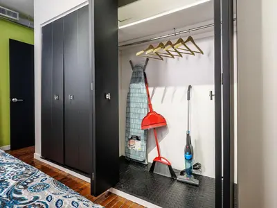 a room with a closet with a red mop at Tasteful 1 Bedroom Apt in Historic Old City in Philadelphia