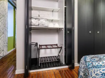 a room with a black closet with a shelf at Tasteful 1 Bedroom Apt in Historic Old City in Philadelphia