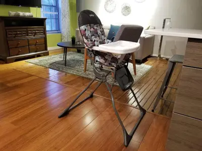 a high chair sitting in a living room at Tasteful 1 Bedroom Apt in Historic Old City in Philadelphia
