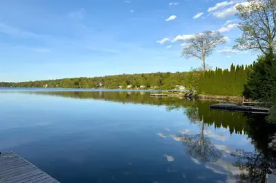 a view of a lake with a dock at Dream Lakefront Escape + Beach/Ski/Golf near NYC in Vernon Township