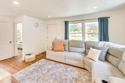 a living room with a couch and a rug at York Farmhouse Hideaway Near Lake Redman in York