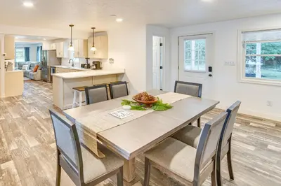 a dining room and kitchen with a table and chairs at York Farmhouse Hideaway Near Lake Redman in York