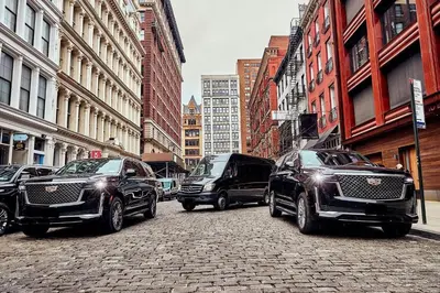 a group of cars parked on a city street at New York shuttles in Brooklyn