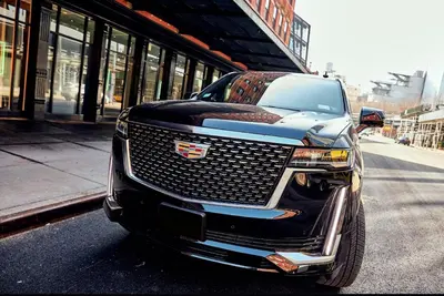a black truck parked on the side of a street at New York shuttles in Brooklyn