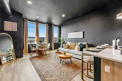 a living room with a couch and a table at Luxe 1br- Free Parking-King Bed in East Orange