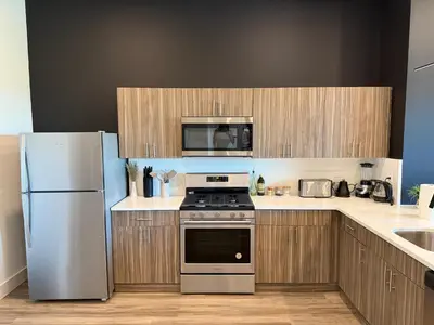 a kitchen with a stove and a refrigerator at NYC View, Free Parking, 2bath in East Orange