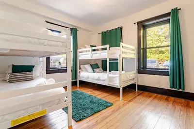 a room with two bunk beds and a window at Lakeview-Sleeps 12-King Suites-7BR - Firepit in Monroe