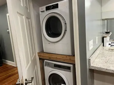 a washing machine and a dryer in a kitchen at Relaxing, Spacious Private Room near Binghamton in Johnson City