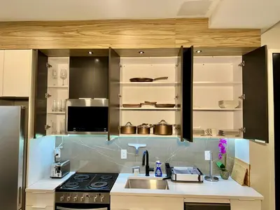 a kitchen with a sink and a stove at BP STAYS - Hotel-Style, No Host, Professionally Managed ID286 in Jersey City