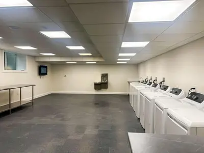 a large room with a row of sinks at 414 Modern Brand New Studio Apartment in Old Bridge