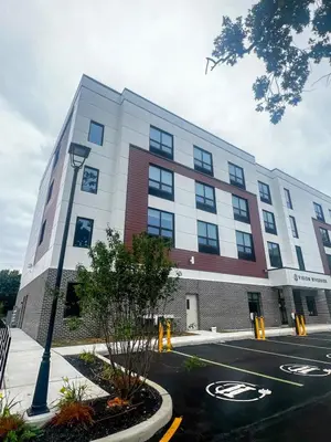 a building with a street light in front of it at 411 Modern Brand New Studio Apartment in Old Bridge