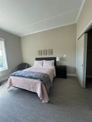 a bedroom with a large bed and a window at 410 Modern Brand New Studio Apartment in Old Bridge