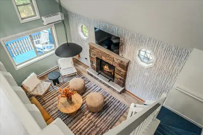 an overhead view of a living room with a fireplace at Pocono Lake Getaway Sauna Hot Tub Playground in Wagners Forest Park