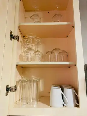 a cupboard filled with glasses and other glass items at Private Estate, Walk to Princeton Downtown, 3-Bedrooms 2-Bath with Free Parking in Princeton