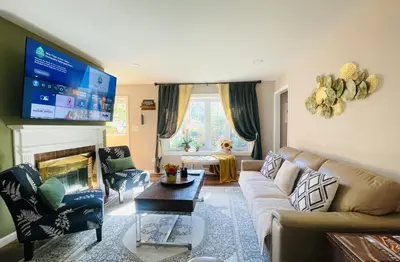 a living room with a couch and a tv at Private Estate, Walk to Princeton Downtown, 3-Bedrooms 2-Bath with Free Parking in Princeton