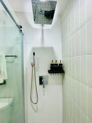a white bathroom with a shower and a sink at Private Estate, Walk to Princeton Downtown, 3-Bedrooms 2-Bath with Free Parking in Princeton