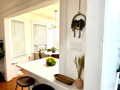 a kitchen with a counter with a bowl of fruit at 20 min NYC-Modern Private Room-Queen Bed-Parking Available But Confirm with Hosts in Jersey City