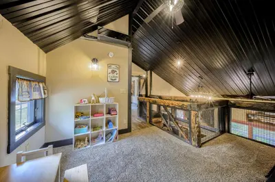 a barn conversion with a gambrel ceiling and a bird cage at Willow Brook Getaway Hot Tub, Deck in Mifflinburg in Mifflinburg
