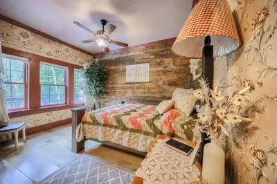 a bedroom with a bed and a ceiling fan at Willow Brook Getaway Hot Tub, Deck in Mifflinburg in Mifflinburg