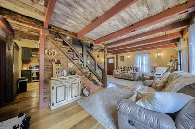 a living room filled with furniture and a wooden ceiling at Willow Brook Getaway Hot Tub, Deck in Mifflinburg in Mifflinburg