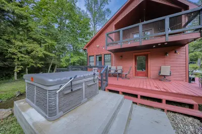 a house with a hot tub on a deck at Willow Brook Getaway Hot Tub, Deck in Mifflinburg in Mifflinburg