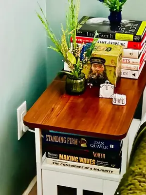a table with a stack of books on it at Heart of Fishtown with parking! in Philadelphia