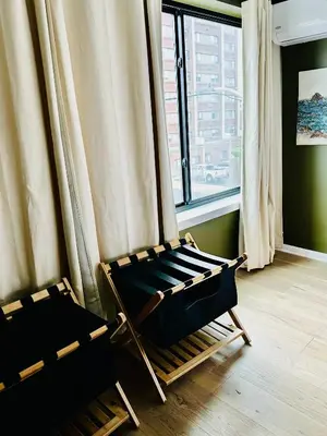 a room with two chairs in front of a window at Heart of Fishtown with parking! in Philadelphia