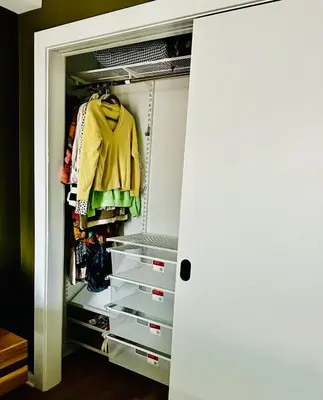 a walk in closet with drawers and a yellow jacket at Heart of Fishtown with parking! in Philadelphia