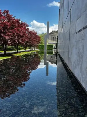 a reflection of a building in a body of water at Heart of Fishtown with parking! in Philadelphia