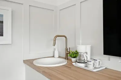 a kitchen counter top with a sink and a counter top at Lakelyn Lodge in Lakeville