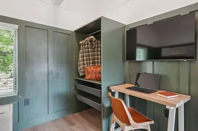 a closet with a desk and a laptop on it at Lakelyn Lodge in Lakeville