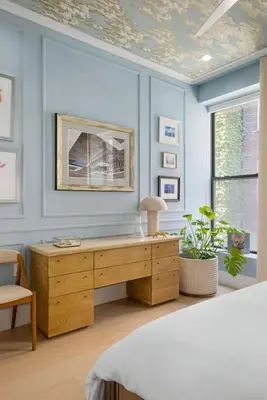 a bedroom with a bed and a wooden desk at Greenwich Village Gem in New York
