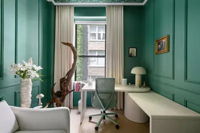 an office with a desk and a chair and a window at Greenwich Village Gem in New York