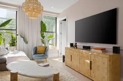 a living room with a flat screen tv on the wall at Greenwich Village Gem in New York