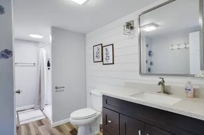 a white bathroom with a sink and a toilet at 108 Escape: Ski-In, Chill-Out |Waterparks & Hiking in Tannersville