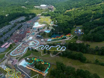 an aerial view of an amusement park with a roller coaster at 108 Escape: Ski-In, Chill-Out |Waterparks & Hiking in Tannersville