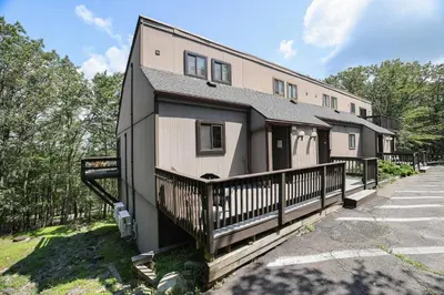 a house with a black and white at 108 Escape: Ski-In, Chill-Out |Waterparks & Hiking in Tannersville