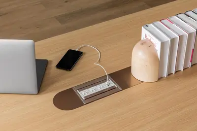 a table with a scale and a laptop and a book at Mint House 70 Pine by Kasa in New York