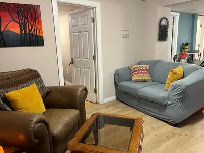 a living room with two couches and a coffee table at Cozy Efficiency Room WalktoUHS, near BU Guthrie in Johnson City