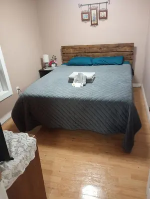 a bedroom with a bed with two towels on it at PR near Lourdes and UHS Hospital in Johnson City