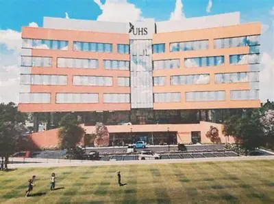 two people standing in front of a large building at Spacious, Unique PR near Binghamton University in Johnson City