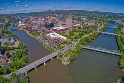 an aerial view of a bridge over a river at Relaxing, Calming PR by Binghamton University in Johnson City