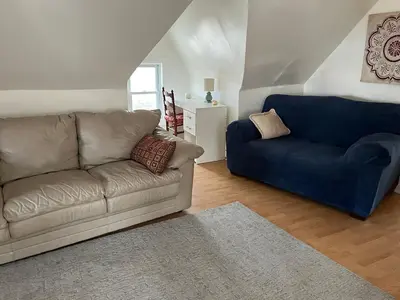 a living room with a couch and a blue couch at Relaxing, Calming PR by Binghamton University in Johnson City