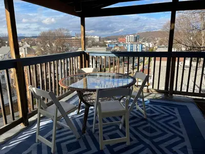 a table and chairs on a balcony with a view at Relaxing, Calming PR by Binghamton University in Johnson City