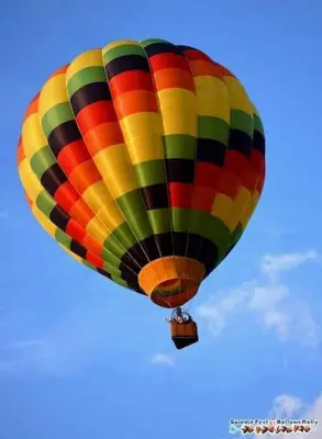 a colorful hot air balloon flying in the sky at Fanciful, Comfy Private Room - Lourdes Hospital in Johnson City