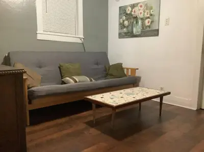 a living room with a couch and a coffee table at Intimate PR near Binghamton University. Free Park in Johnson City
