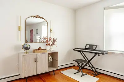 a dressing room with a desk and a mirror at Elegant Spacious Retreat Perfect For Families in Wilmington